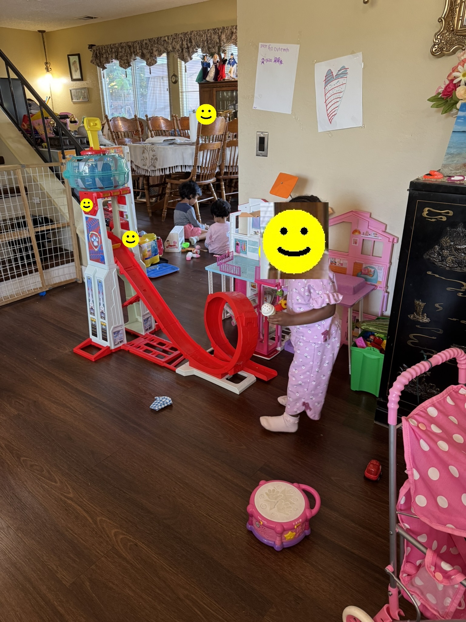 Children playing with toys in the indoor living area